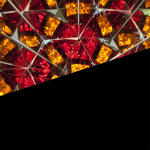 Partial image of a brightly multi-coloured kaleidoscope